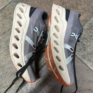 On Running Women’s Athletic Shoes in Gray and Orange